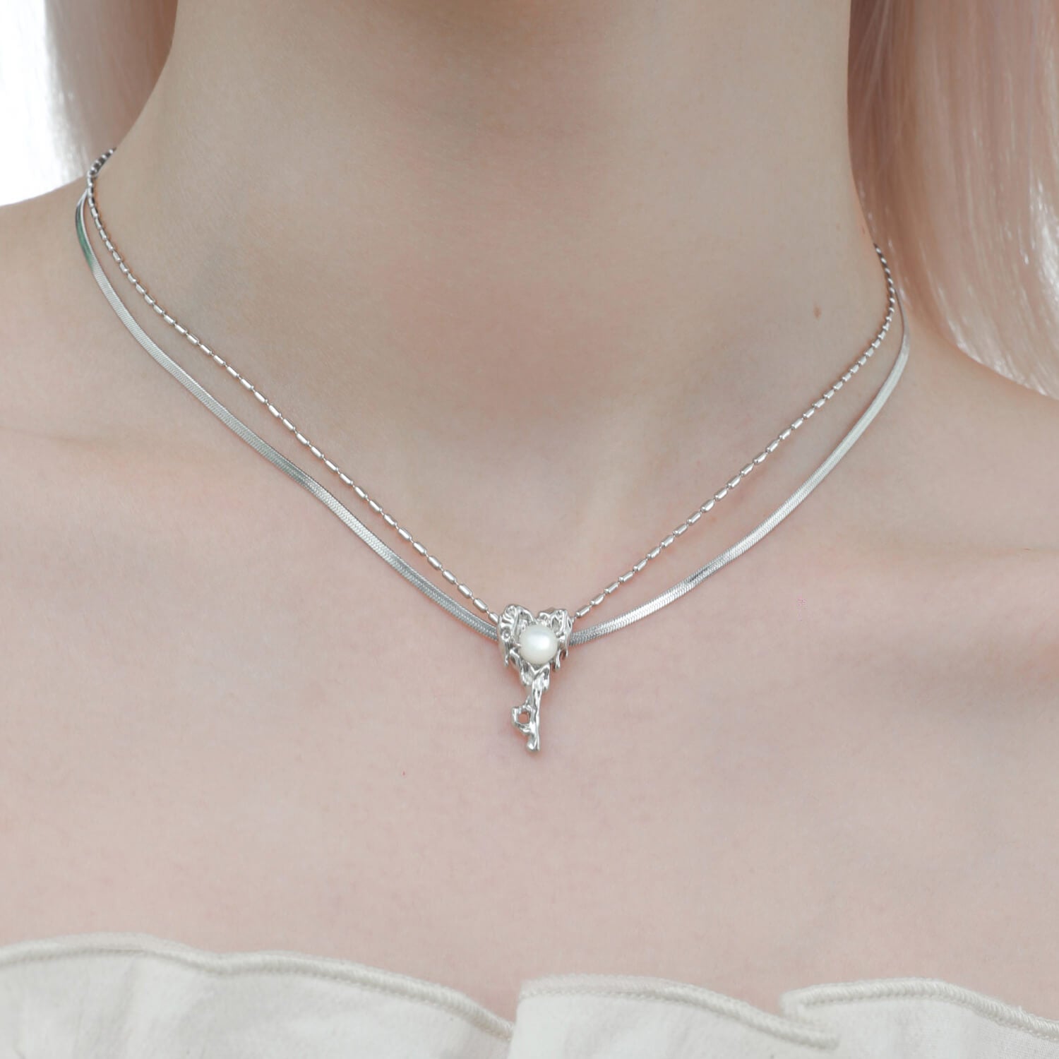 The focal point of this necklace is the heart-shaped key pendant, symbolizing the key to your heart's desires and adding a touch of romance to your style.