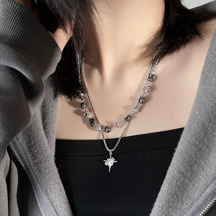 double chain necklace inner chain with beads and yarn like shape while second chain with agate like a stone on star shape pendant